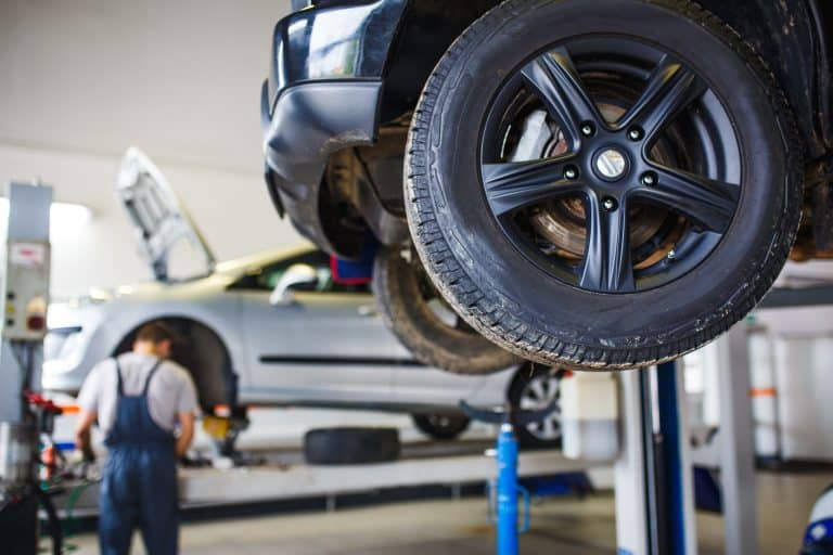 the car is lifted for repair on a lift in a car se 2026 01 09 12 23 25 utc